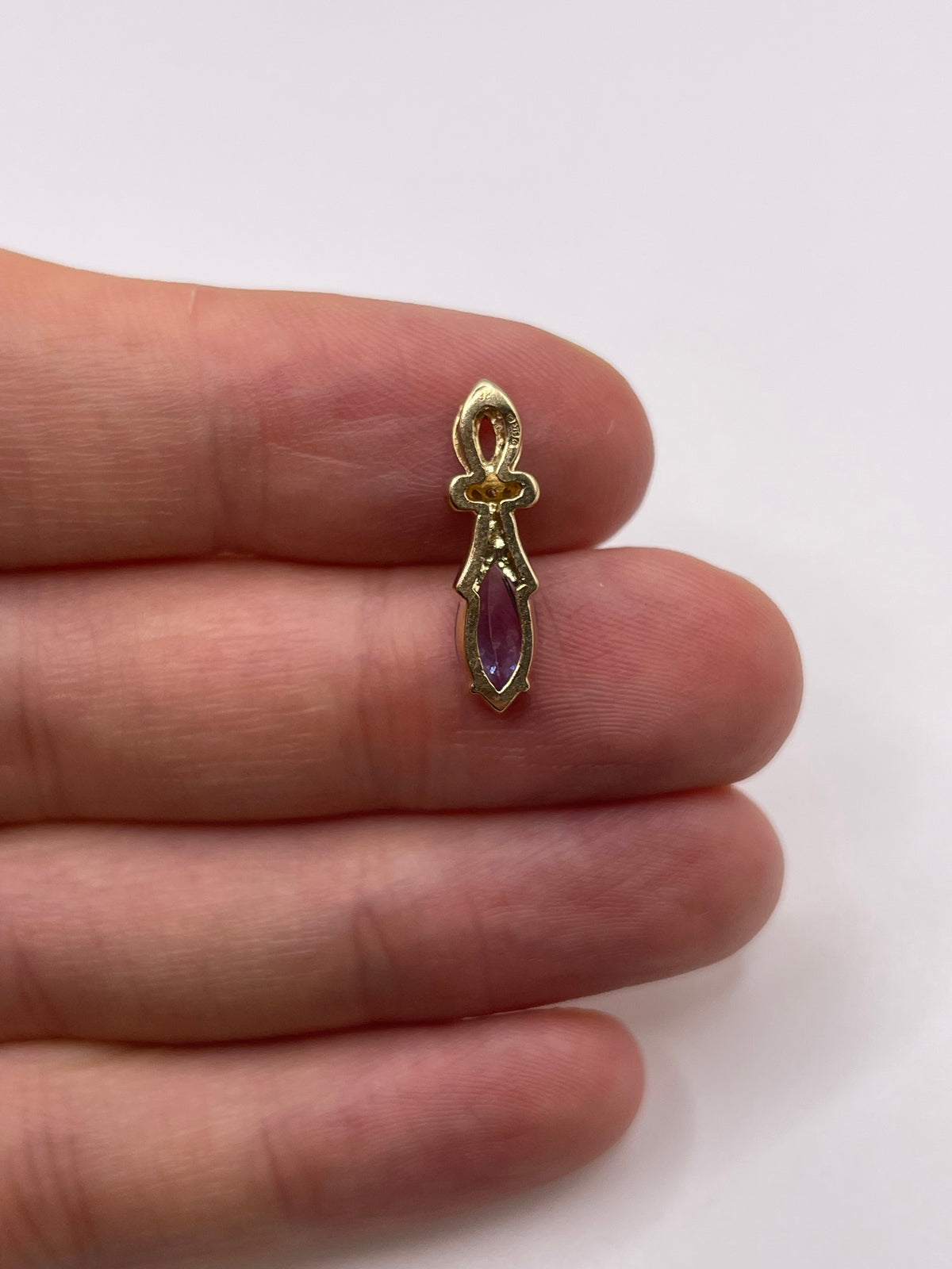 9ct gold tanzanite and diamond pendant