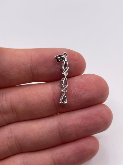 9ct white gold tanzanite and diamond pendant