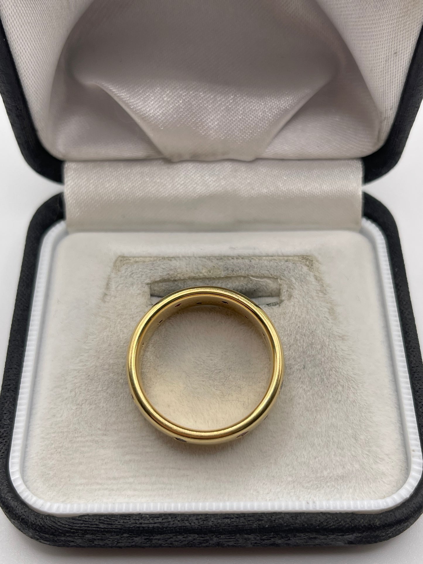 18ct gold ruby, emerald, sapphire and diamond eternity ring