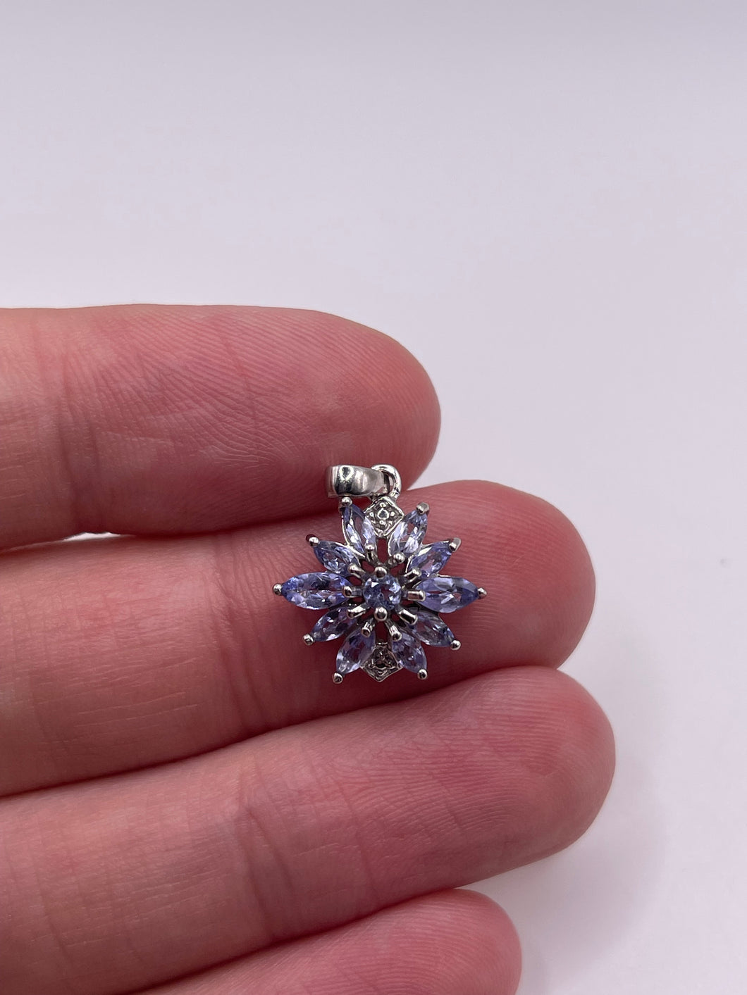 9ct white gold tanzanite and diamond pendant