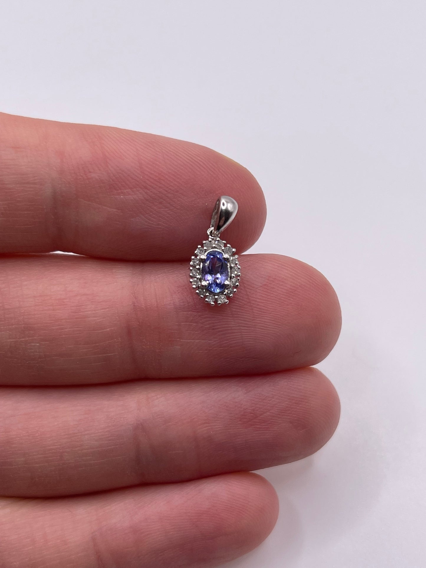 9ct white gold tanzanite and diamond pendant