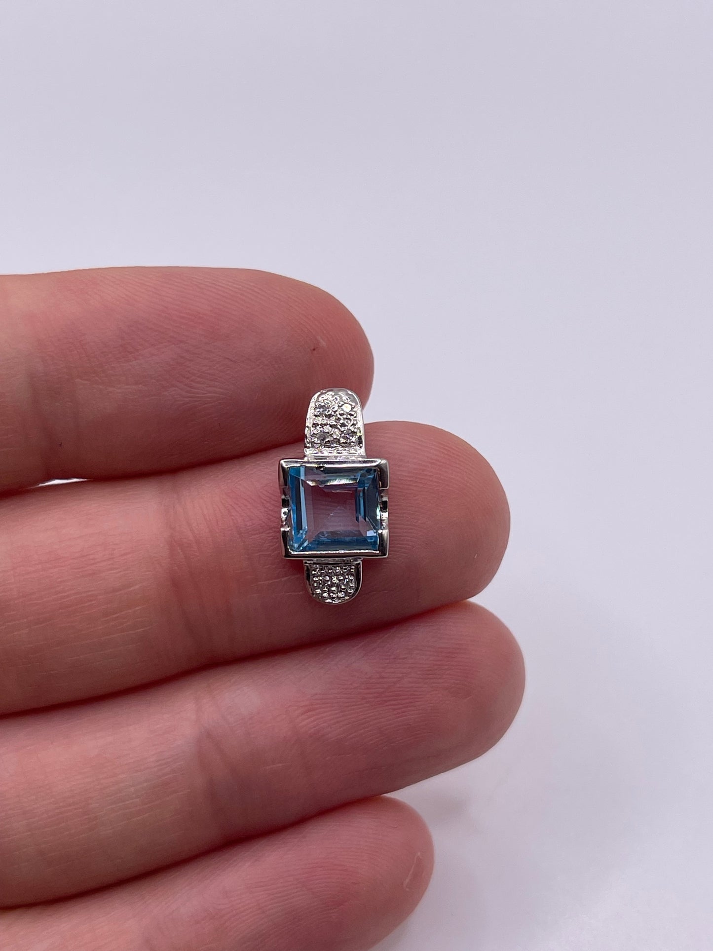 9ct white gold topaz and diamond pendant