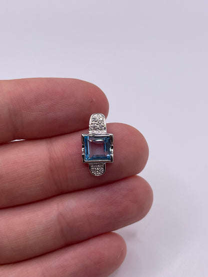 9ct white gold topaz and diamond pendant