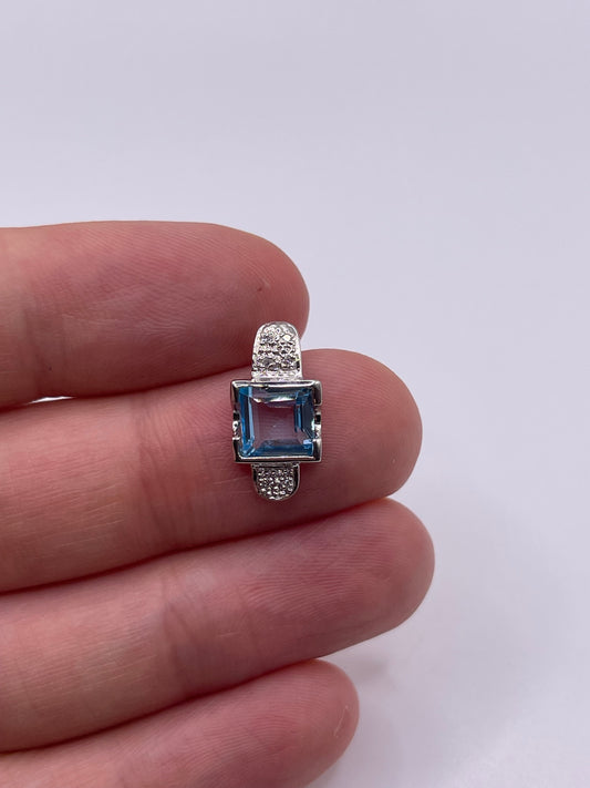 9ct white gold topaz and diamond pendant
