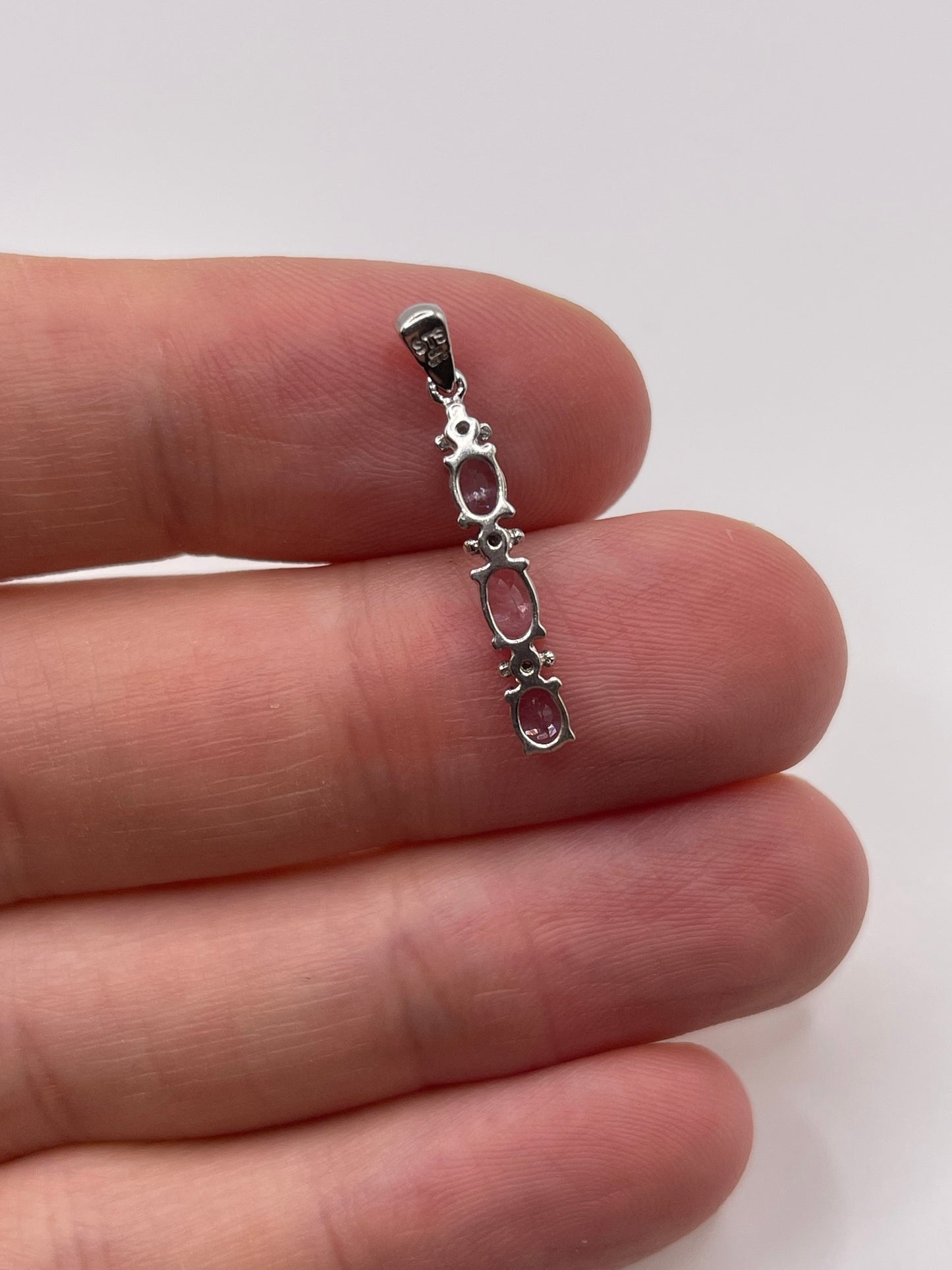 9ct white gold tanzanite and diamond pendant