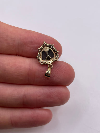 9ct gold Ammolite and zircon pendant