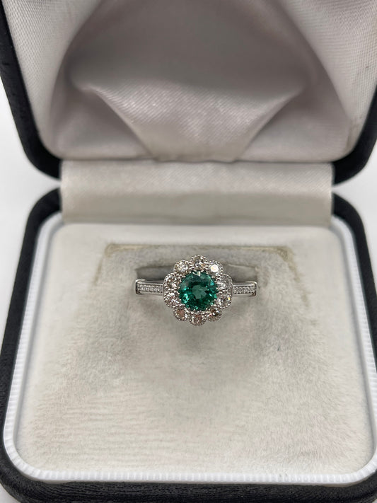 Platinum emerald and diamond ring