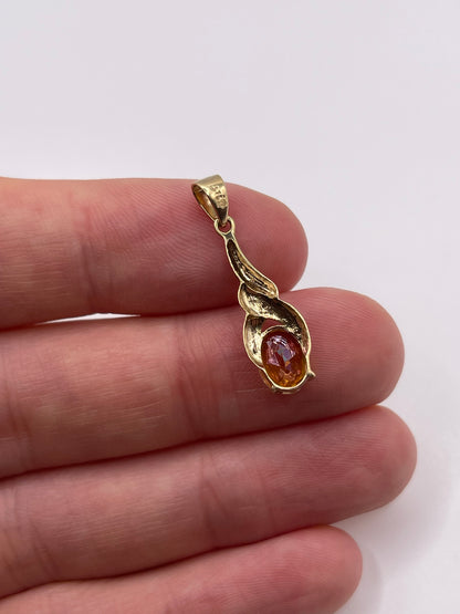 9ct gold topaz and diamond pendant