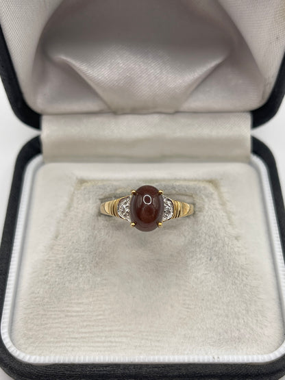 9ct gold cats eye and zircon ring