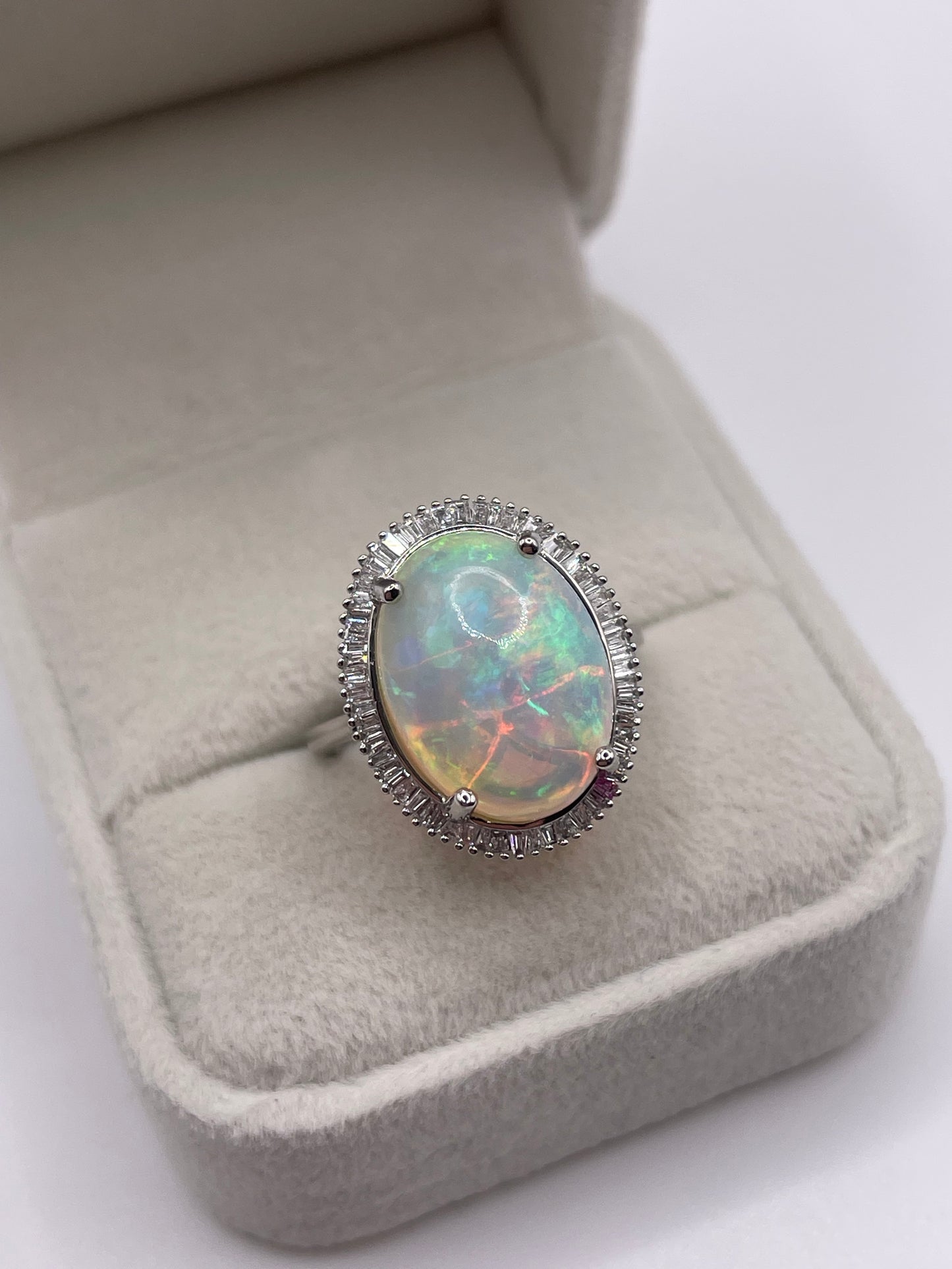 Platinum opal and diamond ring