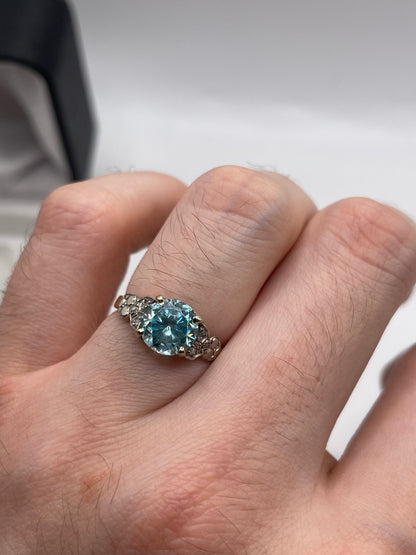 18ct gold blue zircon and diamond ring