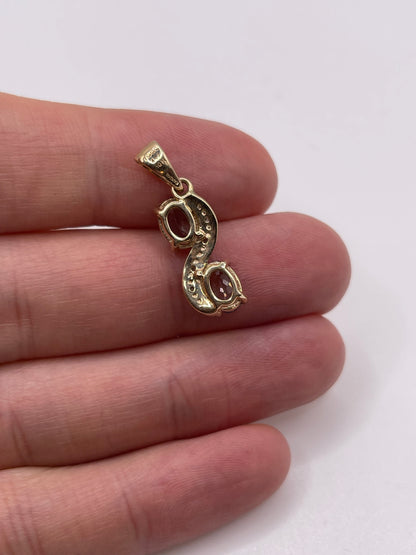 9ct gold tanzanite and diamond pendant