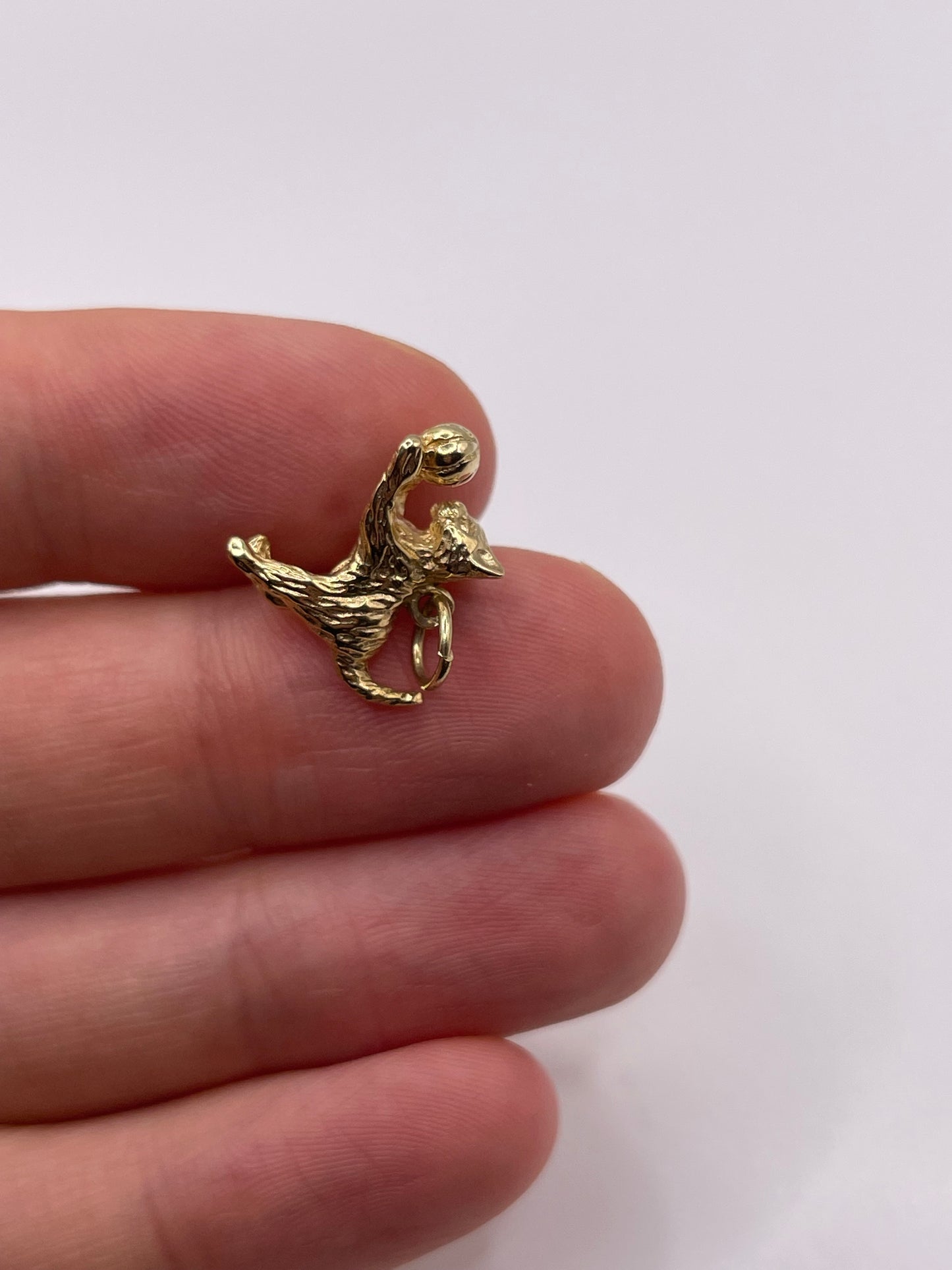 9ct gold cat and ball charm