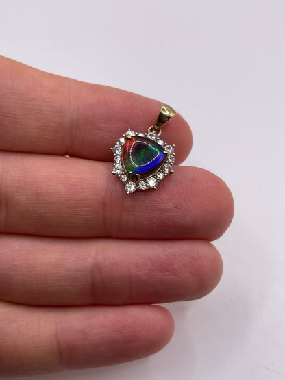 9ct gold Ammolite and zircon pendant