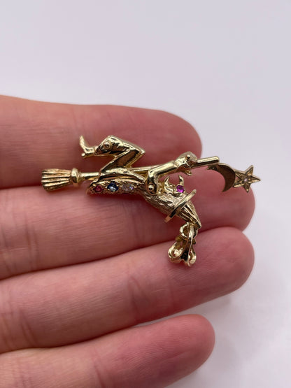 9ct gold stone set articulated witch pendant