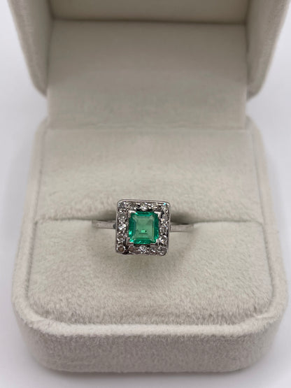 Platinum emerald and diamond ring